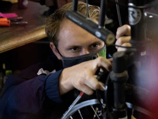 Bike Barn Mechanic Working on a bike